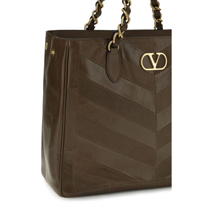 Shoulder Shopper Bag by Valentino Garavani for women in bos taurus nappa calf leather brown, gold, patterned, chevron, signature & patchwork features a effortless sophistication silhouette, secured by a magnetic with ample and versatile shoulder-strap & handle for a effortless sophistication finish.