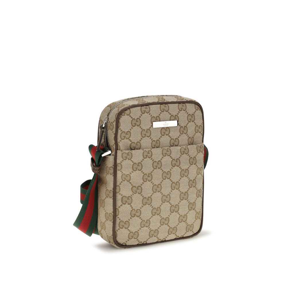 Shoulder Shopper Pouch Bag by Gucci for men in canvas leather & palladium beige, brown, green, palladium, red, signature & striped features a effortless chic silhouette with a secure zipper & magnetic, ample , and versatile shoulder-strap & adjustable-strap for a effortless chic finish.