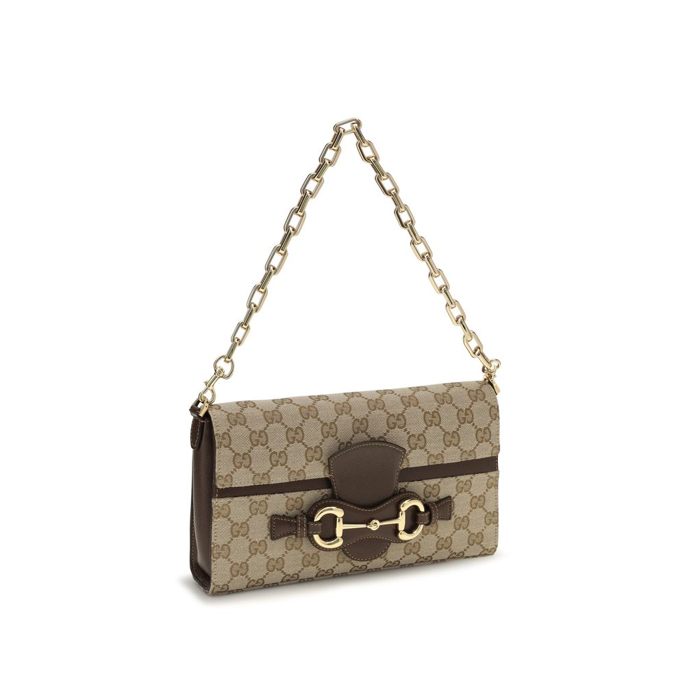 Compact Crossbody Flap Clutch Shoulder Bag by Gucci for women in leather & canvas beige, brown & gold features an effortlessly chic silhouette with a secure flap & zipper, ample , and versatile crossbody-strap, shoulder-strap, adjustable-strap & detachable-strap for effortlessly chic everyday luxury.