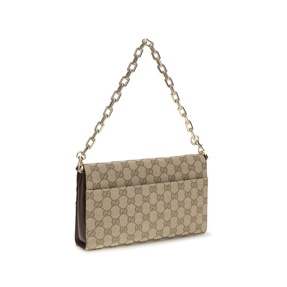 Compact Crossbody Flap Clutch Shoulder Bag by Gucci for women in leather & canvas beige, brown & gold features a effortless sophistication silhouette, secured by a flap & zipper with ample and versatile crossbody-strap, shoulder-strap, adjustable-strap & detachable-strap for a effortless sophistication finish.