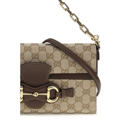 Compact Crossbody Flap Clutch Shoulder Bag by Gucci for women in leather & canvas beige, brown & gold features a distinguished silhouette, showcasing a secure flap & zipper and distinguished with versatile crossbody-strap, shoulder-strap, adjustable-strap & detachable-strap for a distinguished finish.