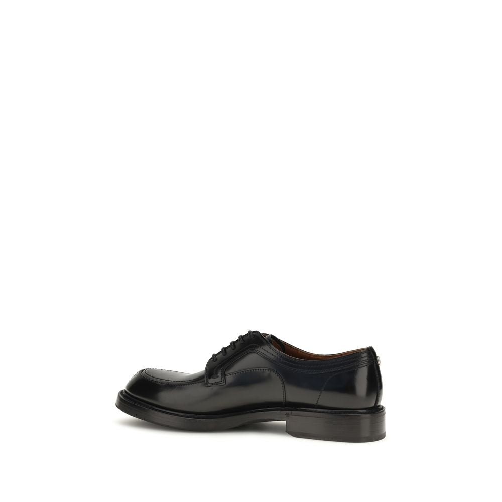 Derby Loafer Shoes by Dolce & Gabbana for men in tu textile & bos taurus calfskin leather black showcases a resplendent Men's TU Textile & Bos Taurus Calfskin Leather Derby Loafer Shoes aesthetic, defined by its resplendent and elegant .