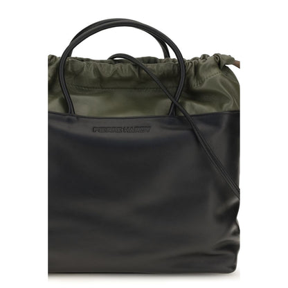 Shoulder Drawstring Bag by Pierre Hardy for women in bos taurus calf leather black features a effortless sophistication silhouette, secured by a drawstring with ample and versatile shoulder-strap & handle for a effortless sophistication finish.