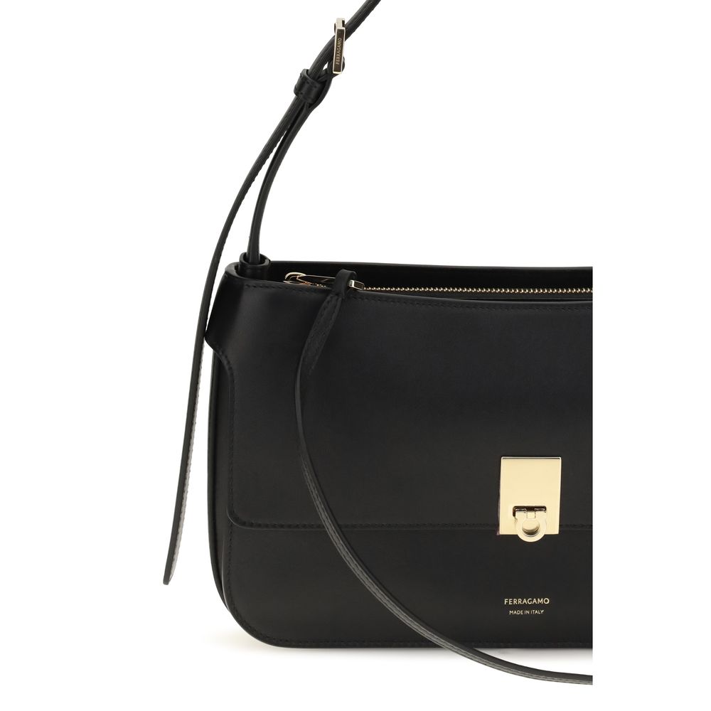 Mini Shoulder Clutch Bag by Ferragamo for women in bos taurus calf leather black features a effortless sophistication silhouette, secured by a with ample external-pockets and versatile shoulder-strap for a effortless sophistication finish.