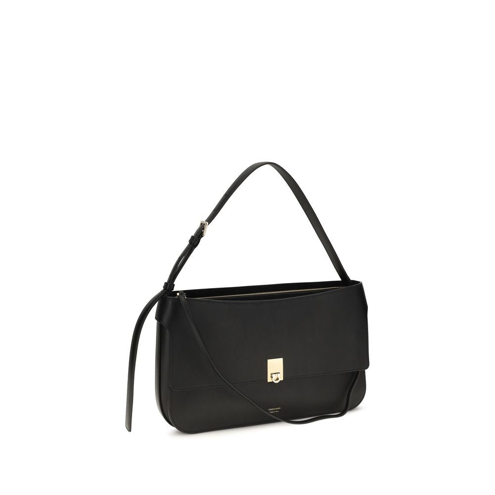 Small Shoulder Clutch Bag by Ferragamo for women in bos taurus calf leather black features a distinguished silhouette, showcasing a secure buckle and distinguished external-pockets with versatile shoulder-strap for a distinguished finish.