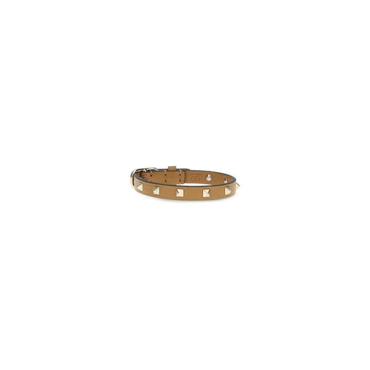 Bracelet by Valentino Garavani for women in bos taurus calfskin leather brown & gold features a architectural silhouette, elegantly showcasing a architectural that defines the Rockstud Women's Bos Taurus Calfskin Leather Bracelet aesthetic.