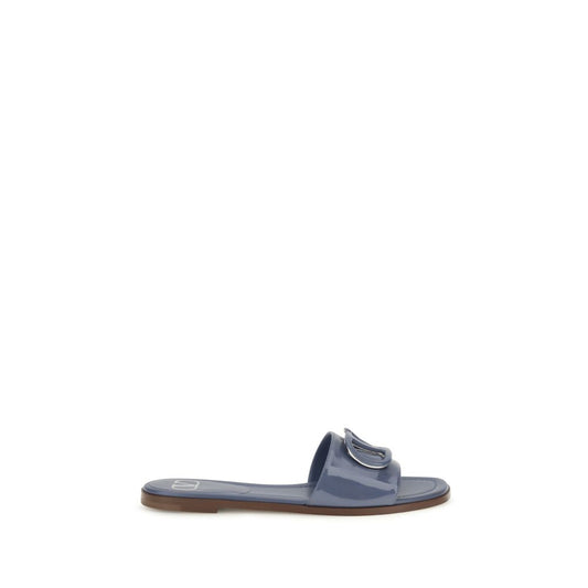 Flat Slider Sandals by Valentino Garavani for women in bos taurus calf patent leather blue showcases a sculptural silhouette as V Logo Women's Bos Taurus Calf Patent Leather Flat Slider Sandals, defined by a sculptural flat and sculptural open toe style for a sculptural look.