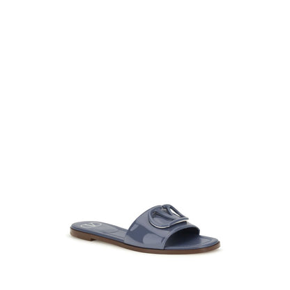 Flat Slider Sandals by Valentino Garavani for women in bos taurus calf patent leather blue features an statuesque V Logo Women's Bos Taurus Calf Patent Leather Flat Slider Sandals silhouette with a refined flat and elegant open toe style.