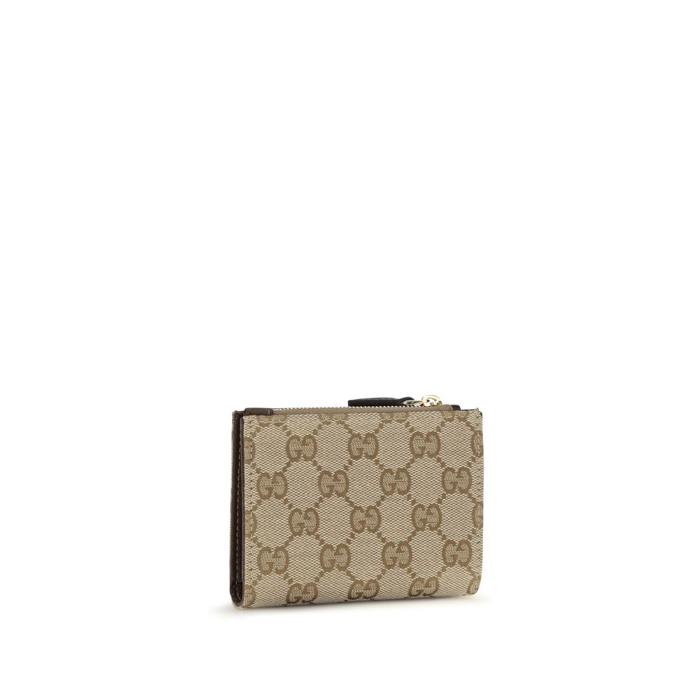 Wallet by Gucci for women in cotton & leather brown & signature showcases a enchanting silhouette, artfully detailed with the signature style of the Gg Horsebit Cotton & Leather Wallet and functional compact-design.