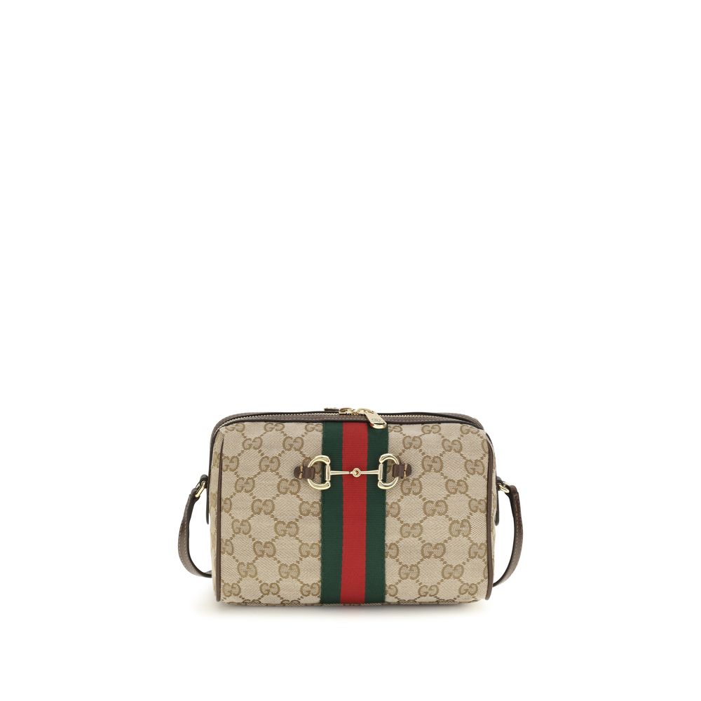 Compact Shoulder Camera Bag by Gucci for women in leather & canvas beige, brown, gold, patterned, signature & striped features a effortless chic silhouette with a secure zipper, ample , and versatile shoulder-strap & adjustable-strap for a effortless chic finish.