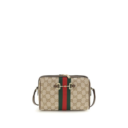 Compact Shoulder Camera Bag by Gucci for women in leather & canvas beige, brown, gold, patterned, signature & striped features a effortless chic silhouette with a secure zipper, ample , and versatile shoulder-strap & adjustable-strap for a effortless chic finish.