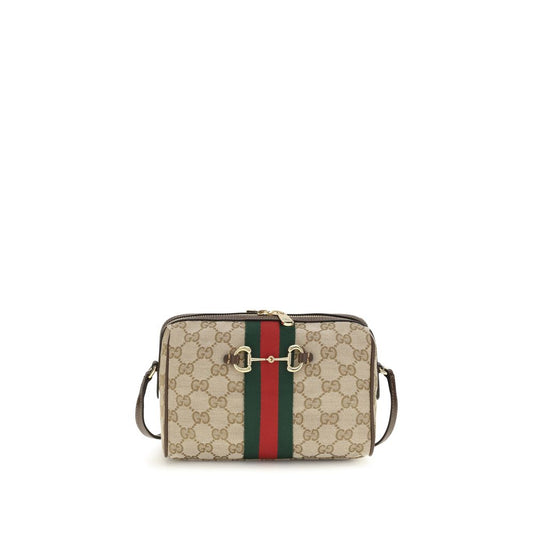 Compact Shoulder Camera Bag by Gucci for women in leather & canvas beige, brown, gold, patterned, signature & striped features a effortless chic silhouette with a secure zipper, ample , and versatile shoulder-strap & adjustable-strap for a effortless chic finish.