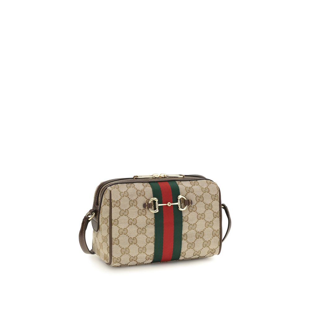 Compact Shoulder Camera Bag by Gucci for women in leather & canvas beige, brown, gold, patterned, signature & striped features a effortless sophistication silhouette, secured by a zipper with ample and versatile shoulder-strap & adjustable-strap for a effortless sophistication finish.