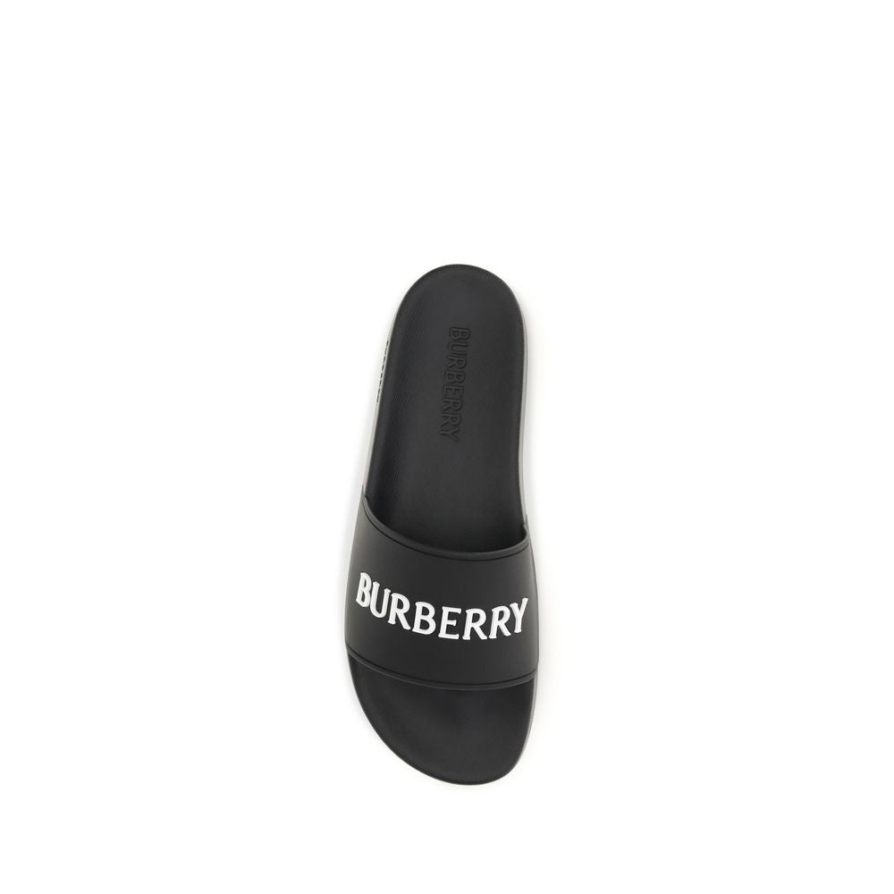 Sandals by Burberry for women in rubber and black presents a captivating silhouette, showcasing the signature style of the Women's Rubber Sandals with a captivating and captivating .