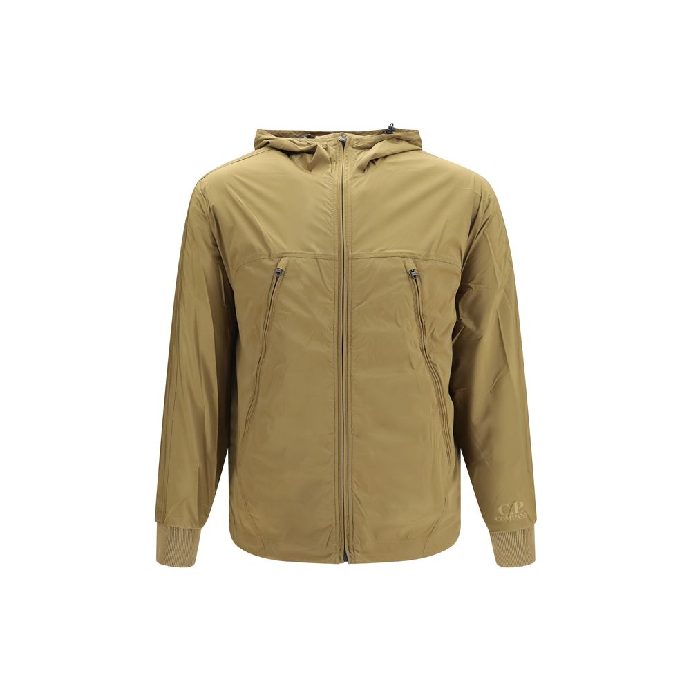 Hooded Windbreaker Jacket by C.P. Company for men in merino wool nylon & polyamide beige presents a resilient silhouette, artfully detailed with a sophisticated hooded neckline and functional pockets, hooded & windproof for a resilient finish.