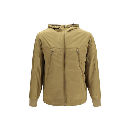 Hooded Windbreaker Jacket by C.P. Company for men in merino wool nylon & polyamide beige presents a resilient silhouette, artfully detailed with a sophisticated hooded neckline and functional pockets, hooded & windproof for a resilient finish.