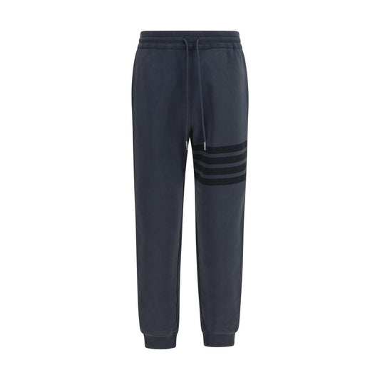 Pants by Thom Browne for men in cotton gray, silver, signature & striped features a enduring silhouette, showcasing a enduring athletic & regular-fit and long with a for a premium, tailored aesthetic.