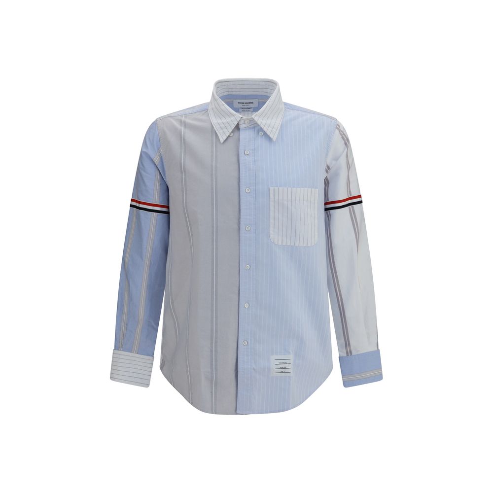 Shirt by Thom Browne for men in cotton blue, patterned, pinstripe, signature & striped features an architectural silhouette with a refined long-sleeve and elegant button-down-collar neckline for a architectural look.