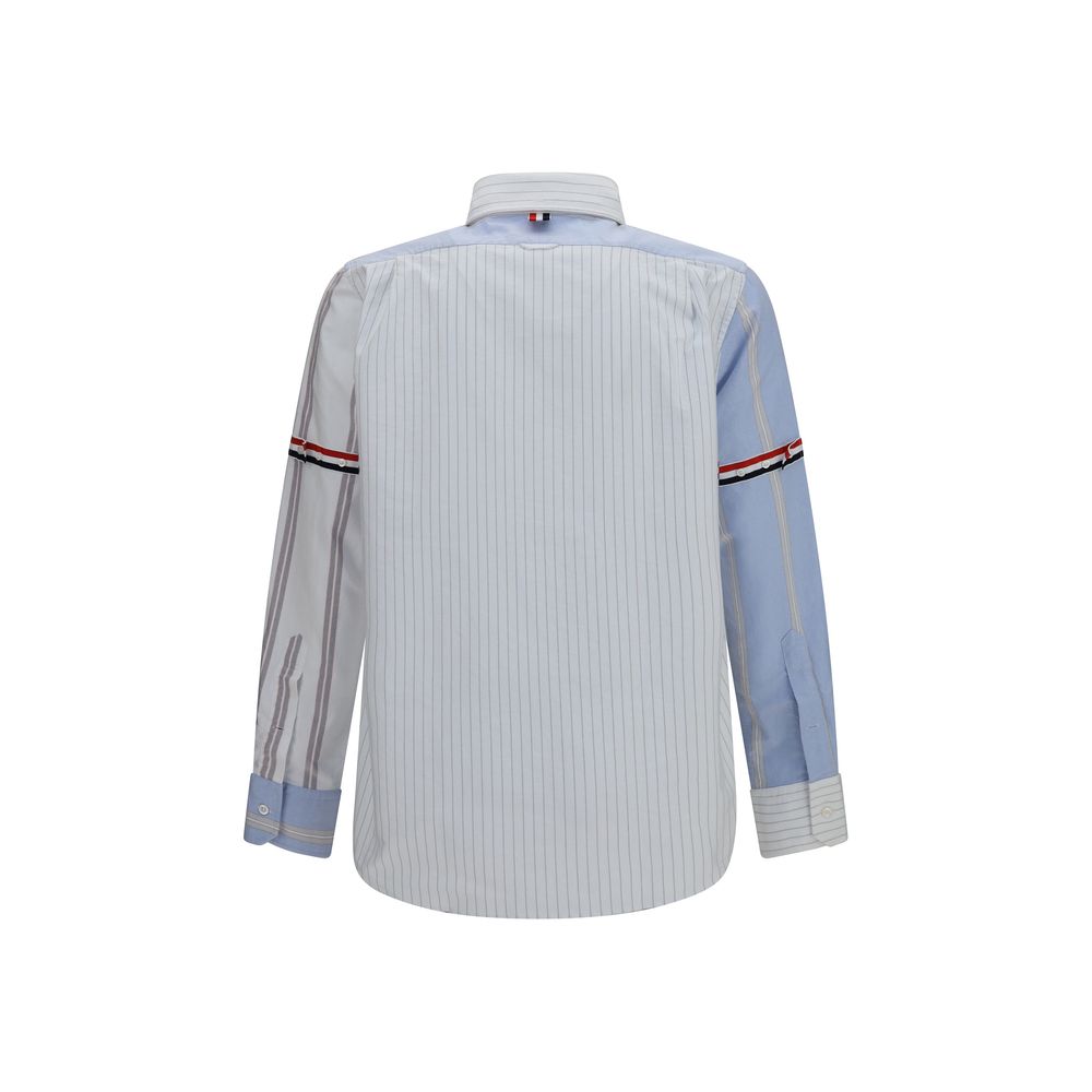 Shirt by Thom Browne for men in cotton blue, patterned, pinstripe, signature & striped showcases a sublime silhouette, artfully detailed with a sublime button-down-collar neckline and for a sophisticated, sublime finish.