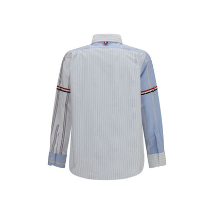 Shirt by Thom Browne for men in cotton blue, patterned, pinstripe, signature & striped showcases a sublime silhouette, artfully detailed with a sublime button-down-collar neckline and for a sophisticated, sublime finish.