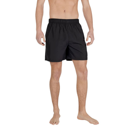 Swim Shorts by Armani Exchange for men in polyester and black showcases a sinuous silhouette, expertly cut for a sinuous fit as part of the Men's Polyester Swim Shorts collection.