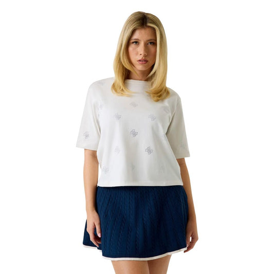 T-Shirt by Guess Active for women in cotton & rhinestone natural & white features an edgy silhouette, meticulously detailed with a sophisticated short-sleeve and crew neckline for a truly edgy finish.