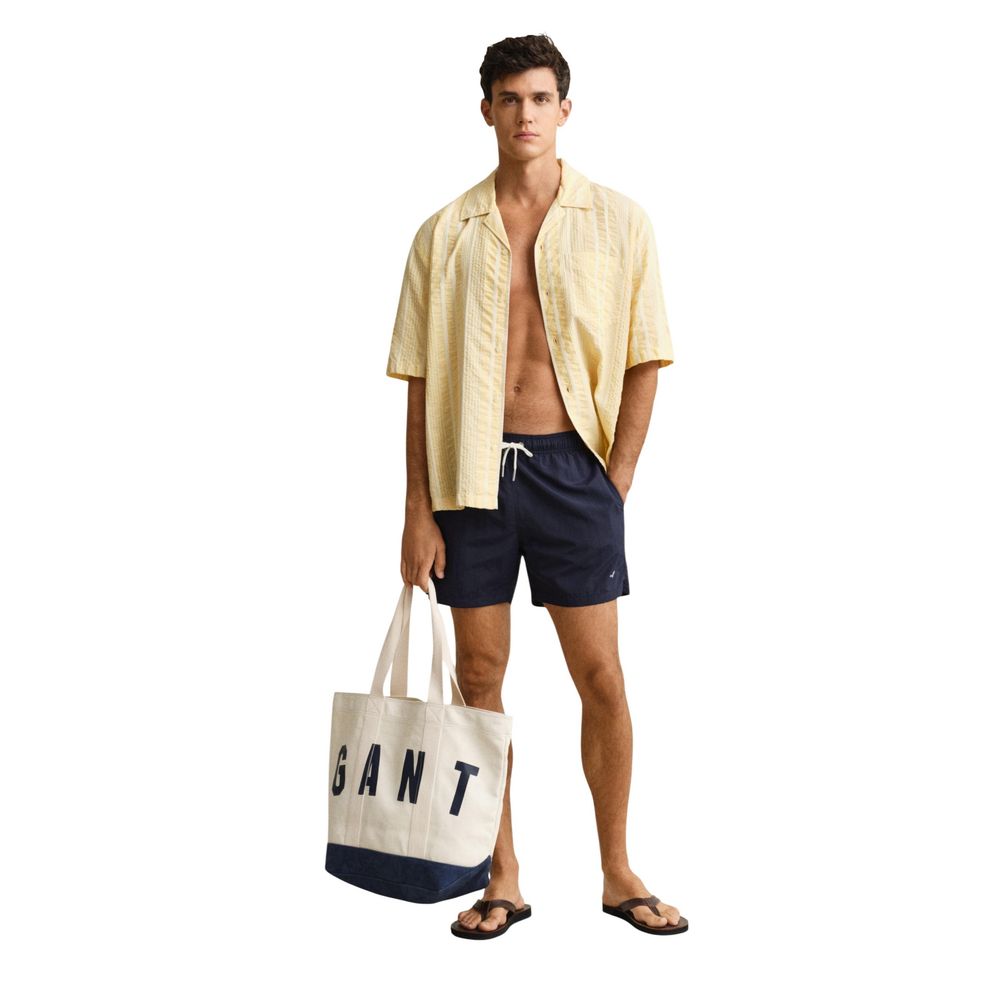 Swim Shorts from Gant for men in polyamide & mesh blue features an sleek silhouette, showcasing the distinct style of the Men's Polyamide & Mesh Swim Shorts collection.