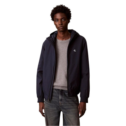 Hooded Overcoat by Calvin Klein Jeans for men in polyester blue features an voluminous silhouette, showcasing distinct lightweight & hooded and a voluminous hooded neckline for a truly voluminous aesthetic.