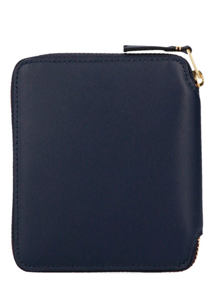 Wallet by Comme Des Garçons for men in calfskin leather blue showcases a discerning silhouette, artfully capturing the essence of Arecalf Calfskin Leather Wallet with its functional zip-around.