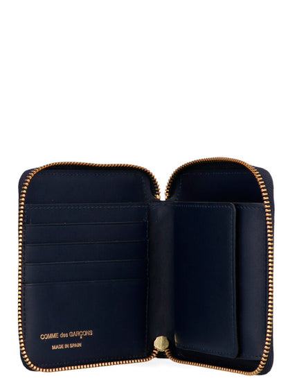 Wallet by Comme Des Garçons for men in calfskin leather blue presents a refined silhouette, artfully capturing the essence of the Arecalf Calfskin Leather Wallet design with sophisticated zip-around for a refined look.