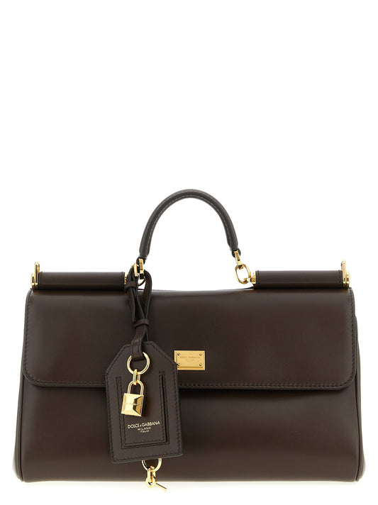 Crossbody Flap Handbag by Dolce & Gabbana for women in calf leather metal & pvc brown features a transformative sophistication silhouette, showcasing a secure flap & zipper, ample , and versatile crossbody-strap, shoulder-strap, adjustable-strap & handle for a transformative sophistication look.