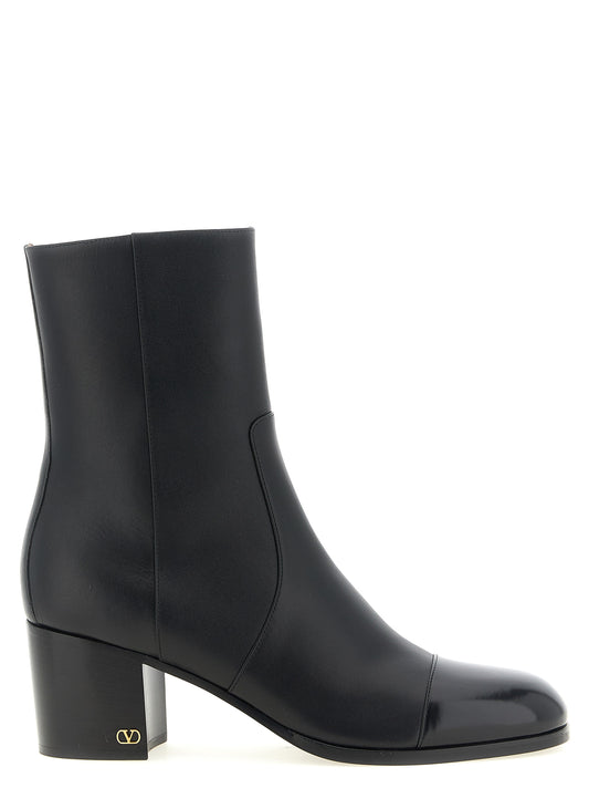 Ankle Boots by Valentino Garavani for women in calfskin leather black, gold & signature features an avant-garde V Logo Women's Calfskin Leather Ankle Boots silhouette, defined by a sophisticated and a avant-garde .