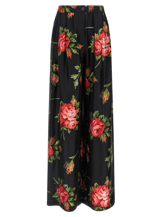 Trousers by Dolce & Gabbana for women in silk twill black, rose, signature & print presents a smart silhouette, meticulously detailed with a smart straight-leg & wide, a smart long, and a smart .