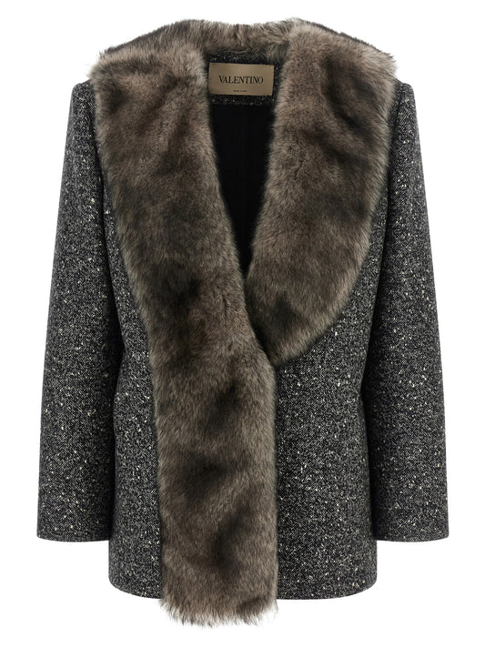 Overcoat by Valentino Garavani for women in polyamide & virgin wool bicolour, black, white & chevron showcases a architectural silhouette, artfully detailed with a distinctive wrap neckline and functional for a architectural finish.