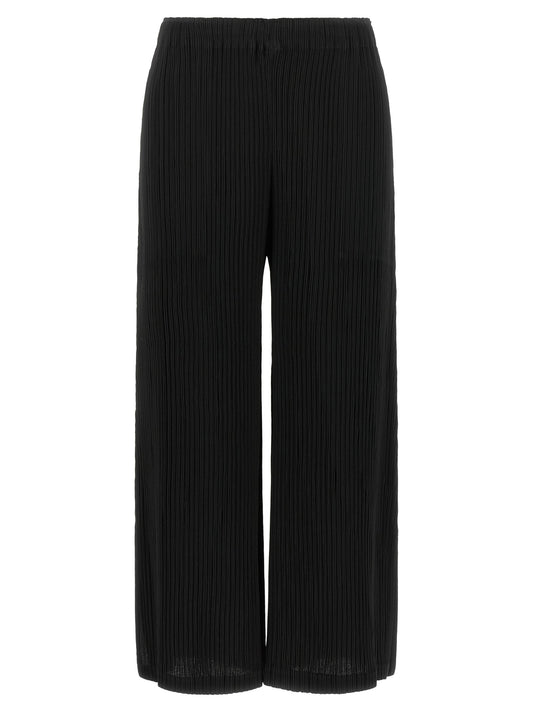 Trousers by Issey Miyake for women in polyester black features an sartorial silhouette, showcasing a precise wide and long with a sartorial for a refined look.