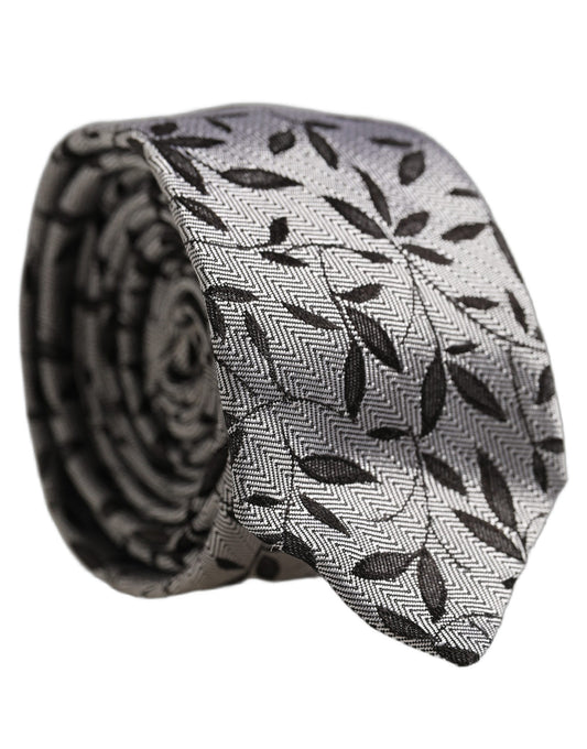 Necktie by Dolce & Gabbana for men in silk black, gray, patterned & herringbone features an effortlessly chic silhouette, showcasing a sophisticated effortlessly chic finish from the signature Silk Necktie collection.