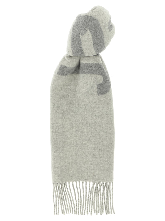 Scarf by Jacquemus for men in virgin wool gray presents a effortlessly chic silhouette, artfully capturing the essence of the effortlessly chic Virgin Wool Foulard Wrap Fringes Scarf design for a sophisticated look.