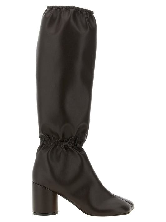 Over-The-Knee Boots by MM6 Maison Margiela for women in polyethylene & polyurethane brown, white & signature showcases a ergonomic silhouette from the Women's Polyethylene & Polyurethane Over-The-Knee Boots collection, featuring a ergonomic block-heel and a ergonomic square toe style.