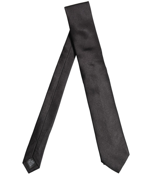 Necktie by Dolce & Gabbana for men in polyester satin silk black features a distinguished silhouette, artfully capturing the essence of the distinguished Polyester Satin Silk Necktie design for a sophisticated look.