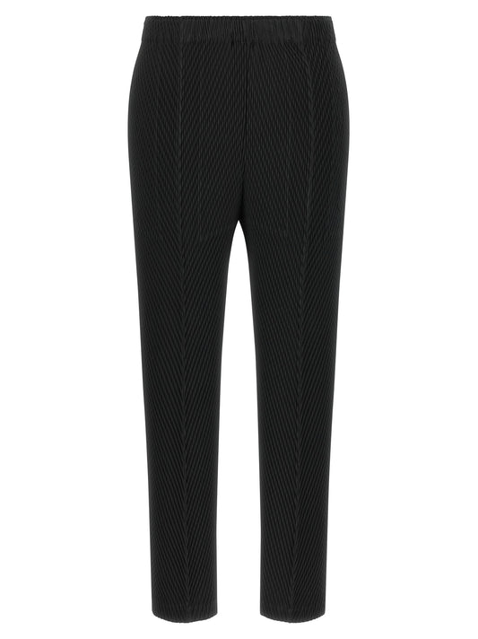 Trousers by Issey Miyake for women in polyester black features a tailored silhouette with a tailored straight & cropped, defined by its cropped and a sophisticated .