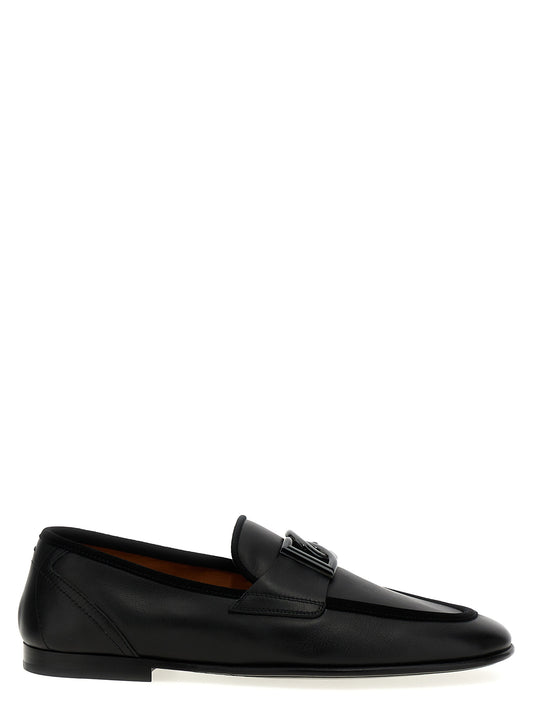 Loafer Slip-On Shoes by Dolce & Gabbana for men in suede calfskin leather black showcases a resplendent Men's Suede Calfskin Leather Loafer Slip-On Shoes aesthetic, defined by its resplendent and elegant .