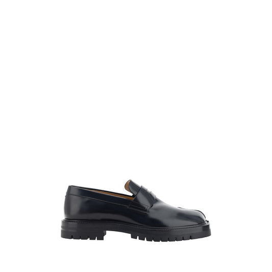 Loafer Slip-On Shoes by Maison Margiela for men in bos taurus calf leather black & signature showcases a impeccable silhouette as Men's Bos Taurus Calf Leather Loafer Slip-On Shoes, artfully designed with a impeccable block-heel and refined almond toe style for a impeccable finish.
