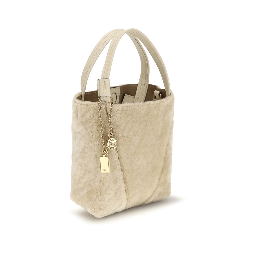 Shoulder Bucket Bag by Chloé for women in bos taurus calf leather beige, gold & signature showcases a enviable silhouette, artfully detailed with a secure , organized single-compartment, and versatile shoulder-strap, handle & adjustable-strap for a enviable look.