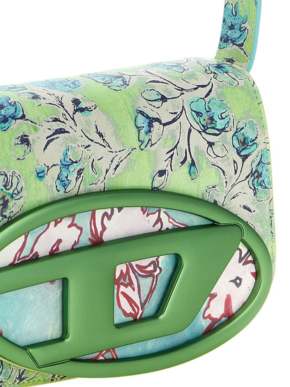 Mini Shoulder Flap Bag by Diesel for women in leather metal & polyethylene blue, green, multicolor, floral & print features a enviable silhouette, showcasing a secure flap & magnetic, ample , and enviable shoulder-strap, adjustable-strap & handle for a enviable finish.