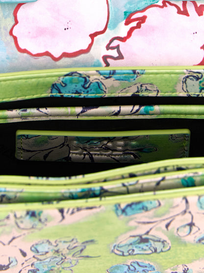 Mini Shoulder Flap Bag by Diesel for women in leather metal & polyethylene blue, green, multicolor, floral & print showcases a enviable silhouette, artfully detailed with a secure flap & magnetic, organized , and versatile shoulder-strap, adjustable-strap & handle for a enviable look.