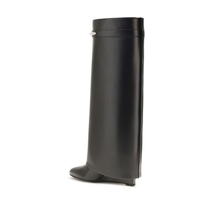 Wedge Boots by Givenchy for women in bos taurus calf leather black & gold features an effortless chic silhouette from the Women's Bos Taurus Calf Leather Wedge Boots collection, showcasing a effortless chic wedge and refined pointed toe style for an effortless chic look.