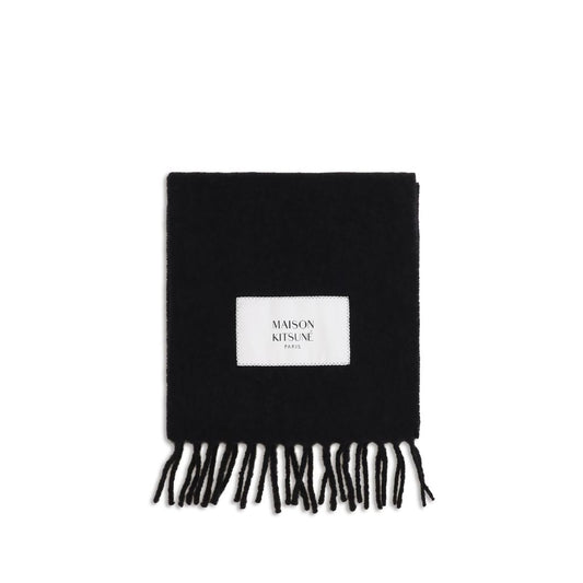 Scarf by Maison Kitsuné for men in polyamide & alpaca wool black & monogram showcases a warm silhouette from the Polyamide & Alpaca Wool Wrap Fringes Scarf collection, offering a warm drape that exudes sophisticated luxury.