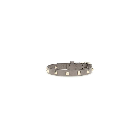 Bracelet by Valentino Garavani for women in bos taurus calf leather gray & gold showcases a luminous , artfully capturing the essence of the luminous Rockstud Women's Bos Taurus Calfskin Leather Bracelet collection.