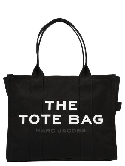 This Large Shopper Tote Bag by Marc Jacobs for women in cotton canvas bicolour, black, white & print features an on trend Cotton Canvas Large Shopper Tote Bag design with a secure zipper, ample , and on trend handle.