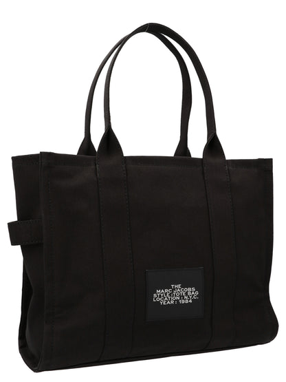 Large Shopper Tote Bag by Marc Jacobs for women in cotton canvas bicolour, black, white & print features a urban sophisticate Cotton Canvas Large Shopper Tote Bag design with a secure zipper, ample , and versatile handle for a urban sophisticate finish.